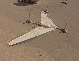 Dust dunes build up against the wing of one of the Pegasus microlights