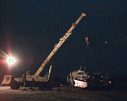 Grayston, White and Sparrow crane ThrustSSC onto its trailer