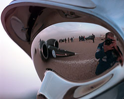 ThrustSSC at the finish of Run 17 reflected in a fire helmet