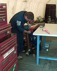 Nick Dove working on one of the massive rear suspension struts