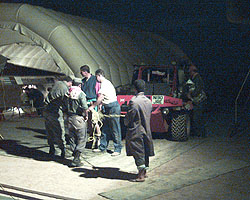 Team members and Jordanian personnel secure the pits area