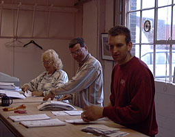 Dee Campbell-Coombe, Neal Fletcher and John Lovatt stuffing envelopes