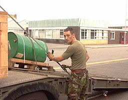 Cpl Smith strapping down the barrel of Active Suspension Fluid