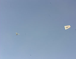 One of the Pegasus microlights trails the '687' banner