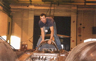 Robbie Kraike checks over the cockpit canopy